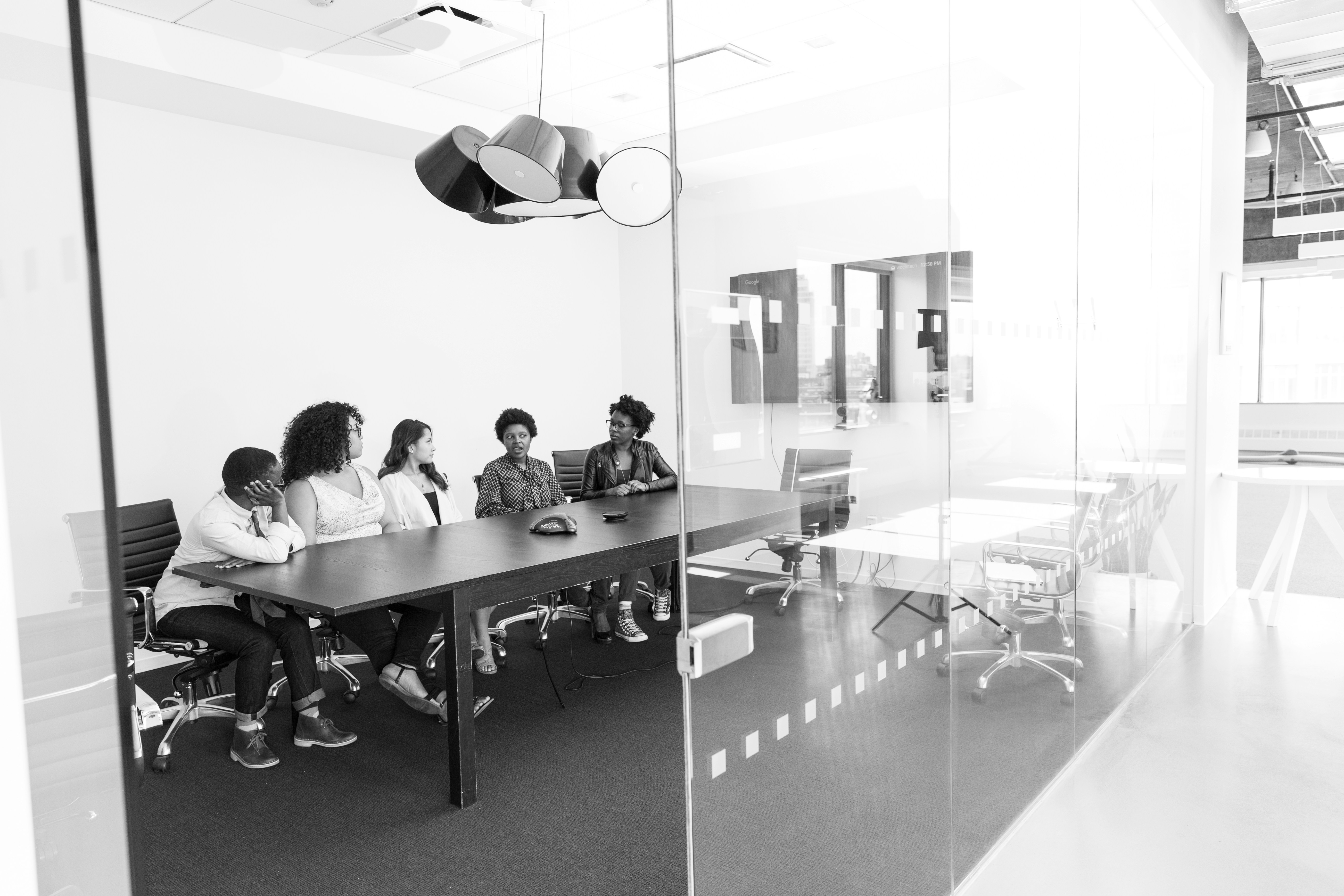 Professional diverse team in modern office meeting representing African business excellence and heritage